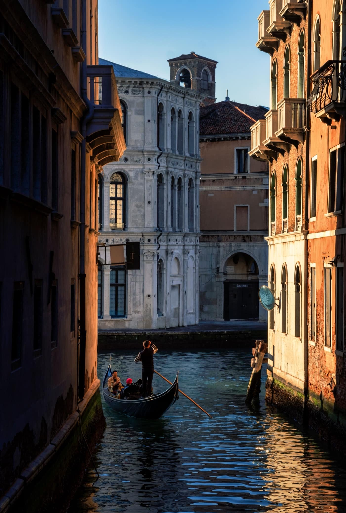 A quiet canal in Venice in the early morning light
